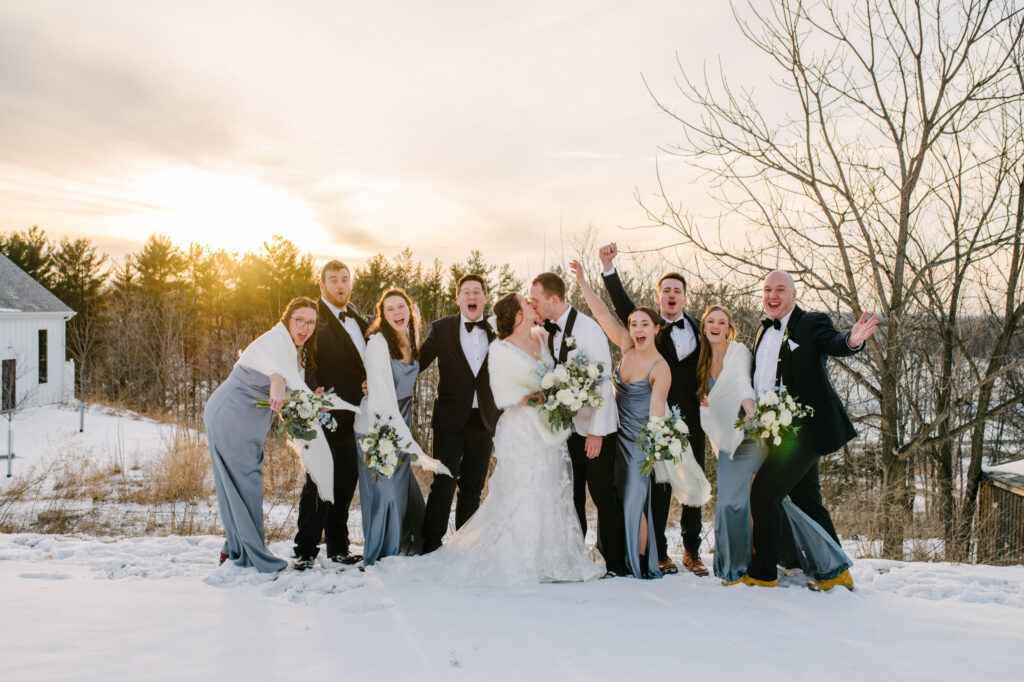 Winter Wedding Party cheering at sunset at the fields reserve