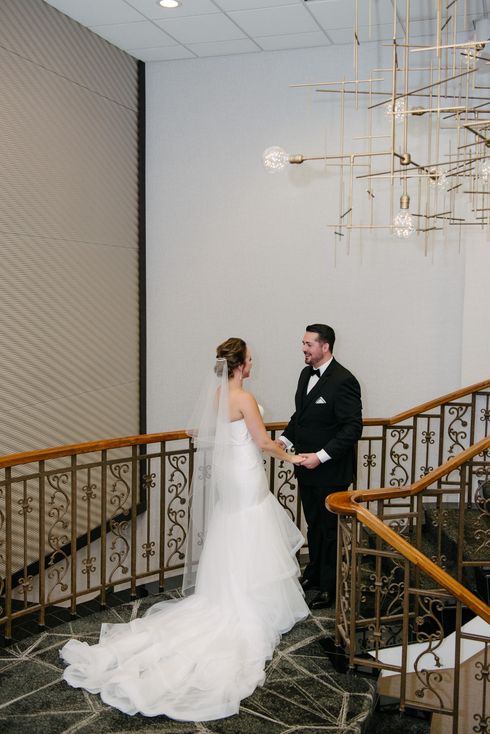 Bride and Groom First Look on the staircase at the Concourse