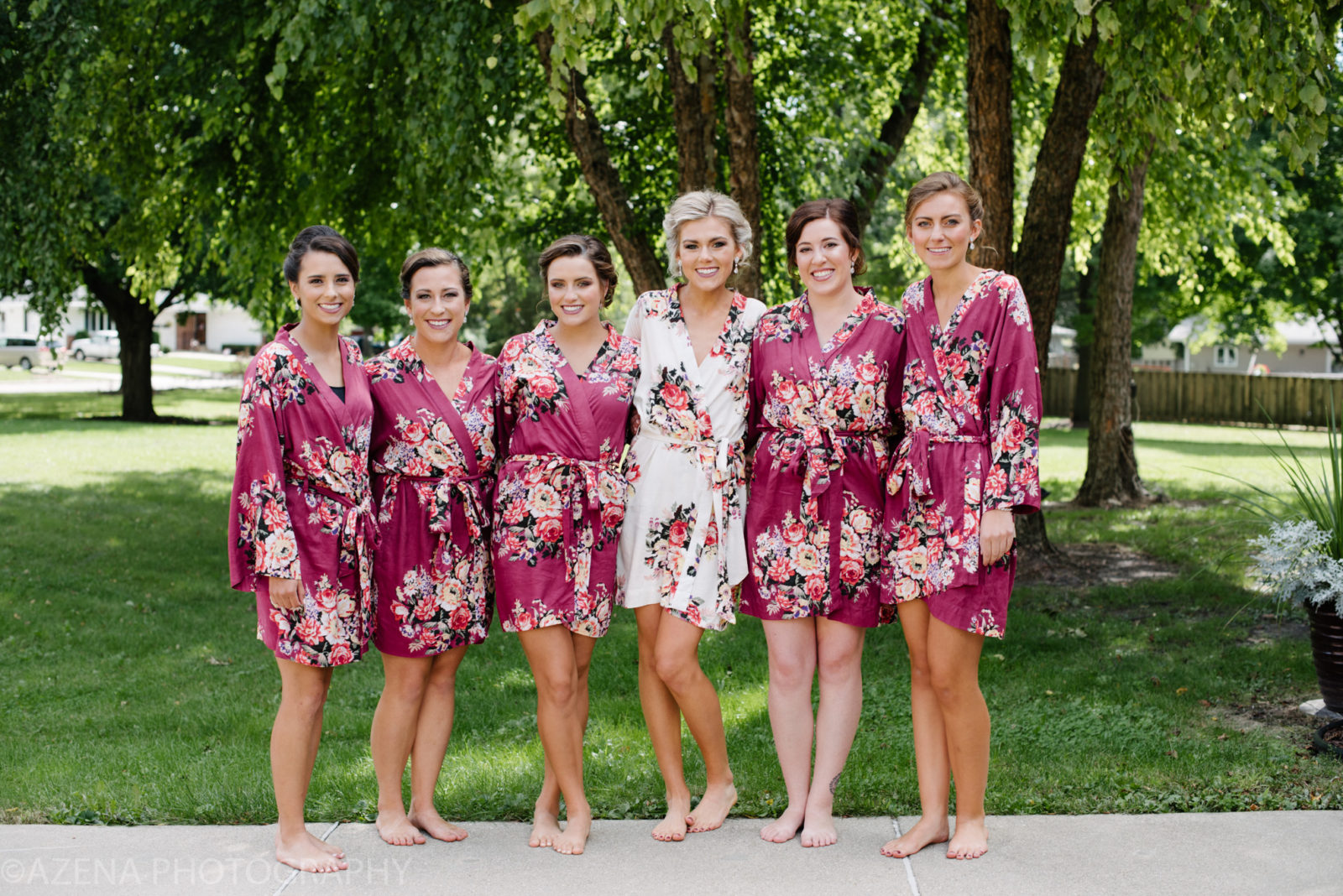 Bridesmaids wearing matching floral robes