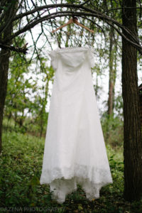 Wedding dress hanging in the woods