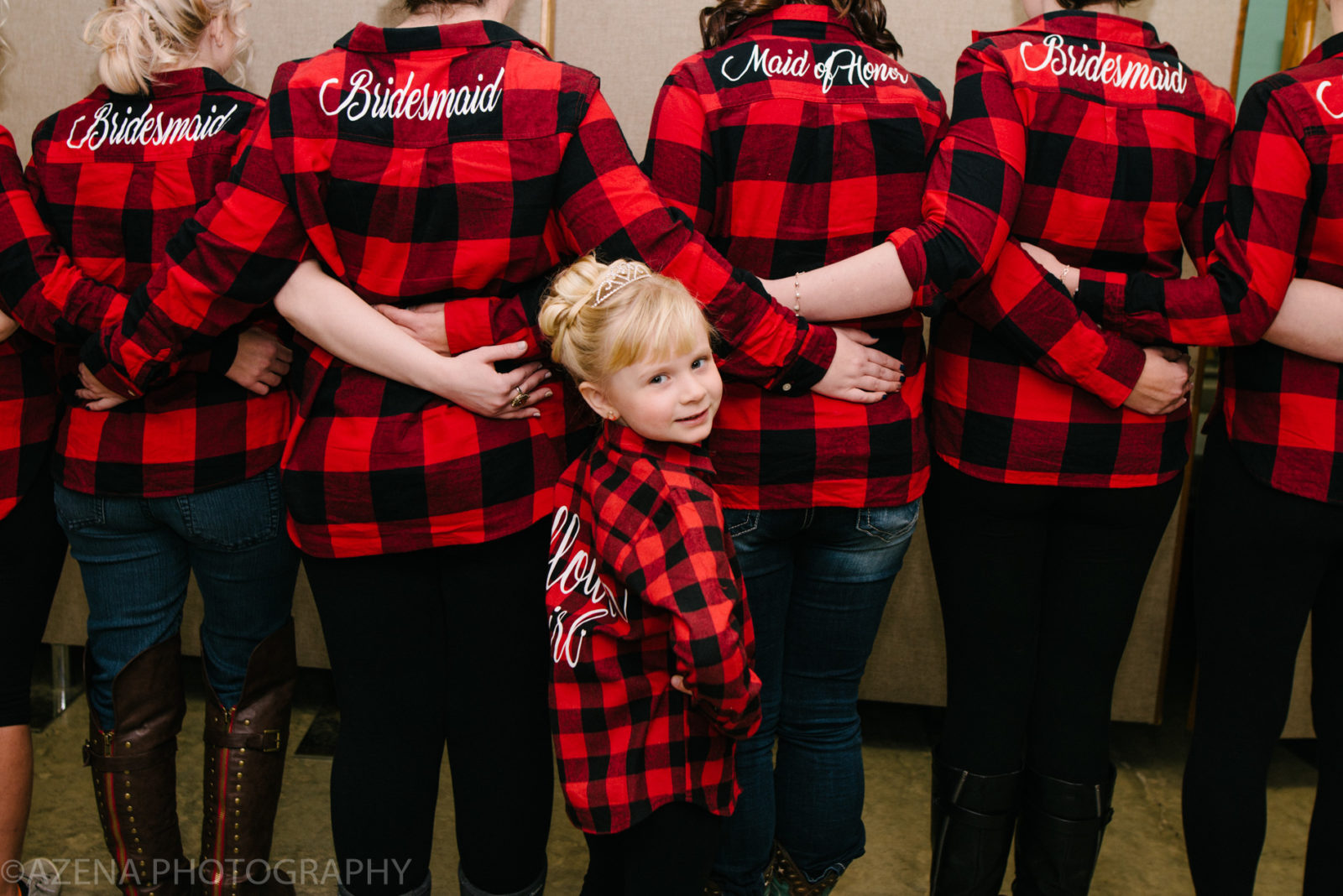 bridesmaids wearing red flannel shirts