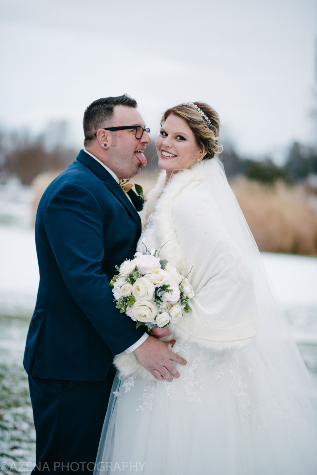 bride and groom outside for winter wedding at lake windsor