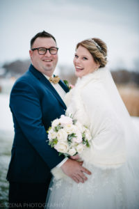 bride and groom outside for winter wedding at lake windsor