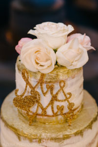 gold wedding cake with flowers