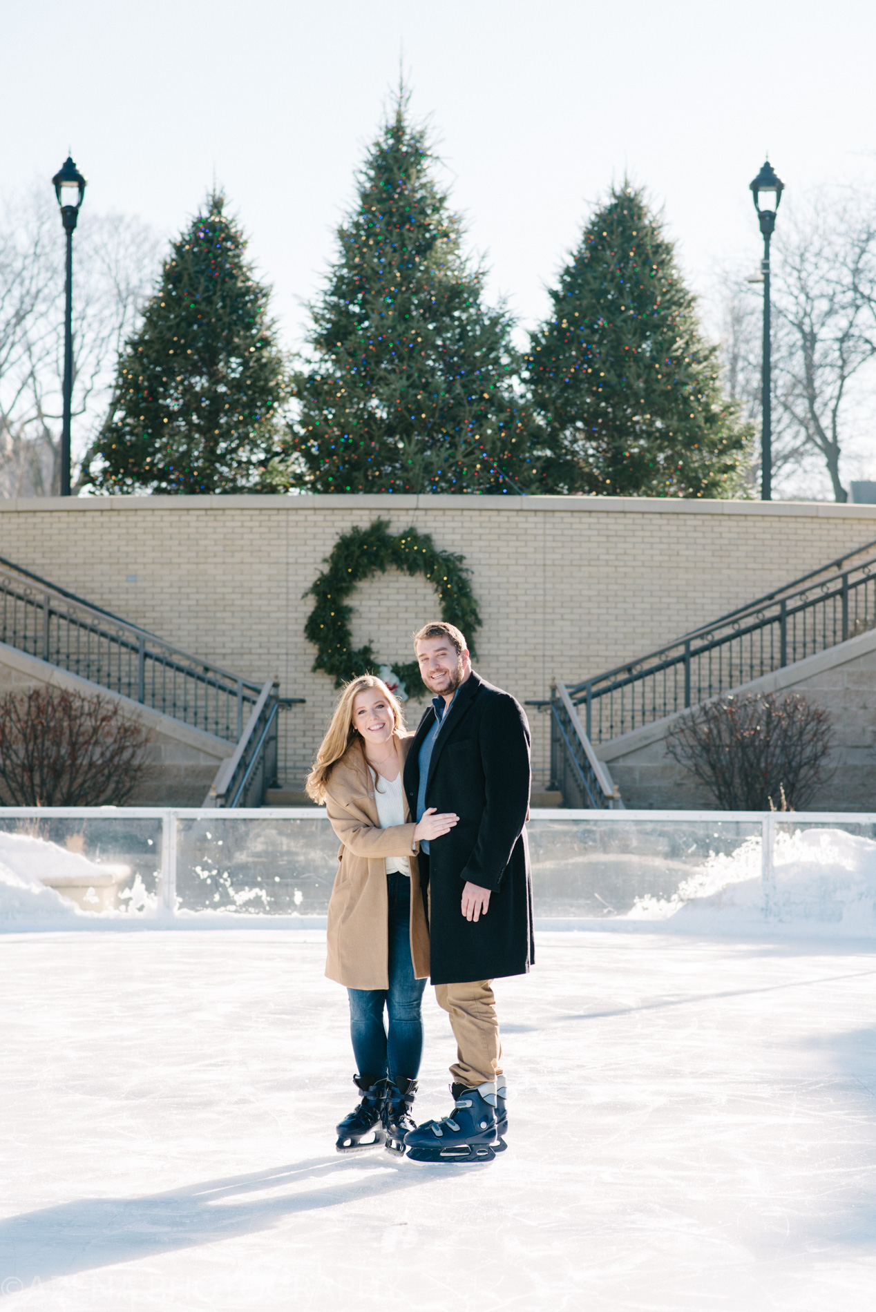 Engagement session on the ice skating rink at the Edgewater in Madison WI at Christmas