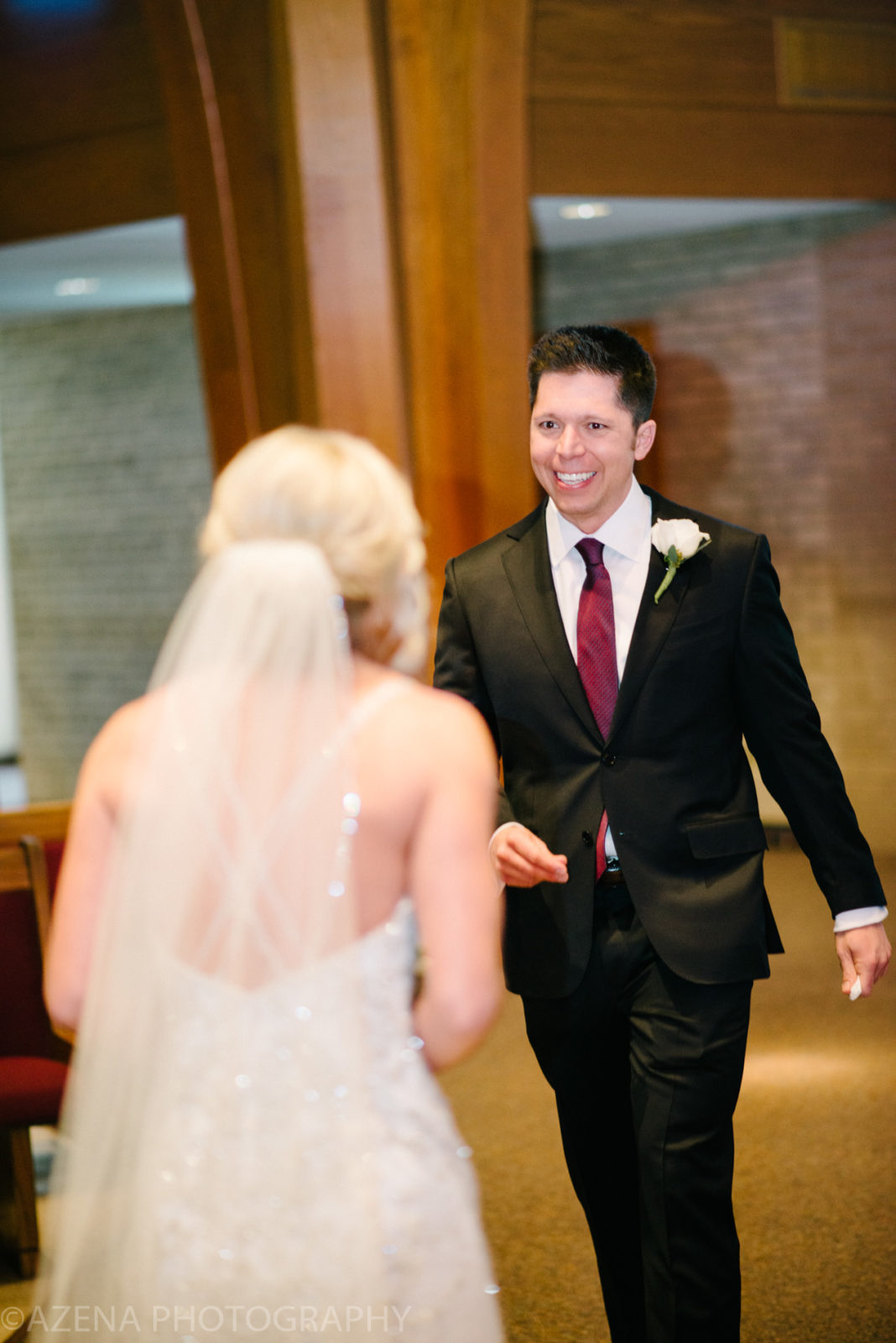 Happy groom sees bride for first look