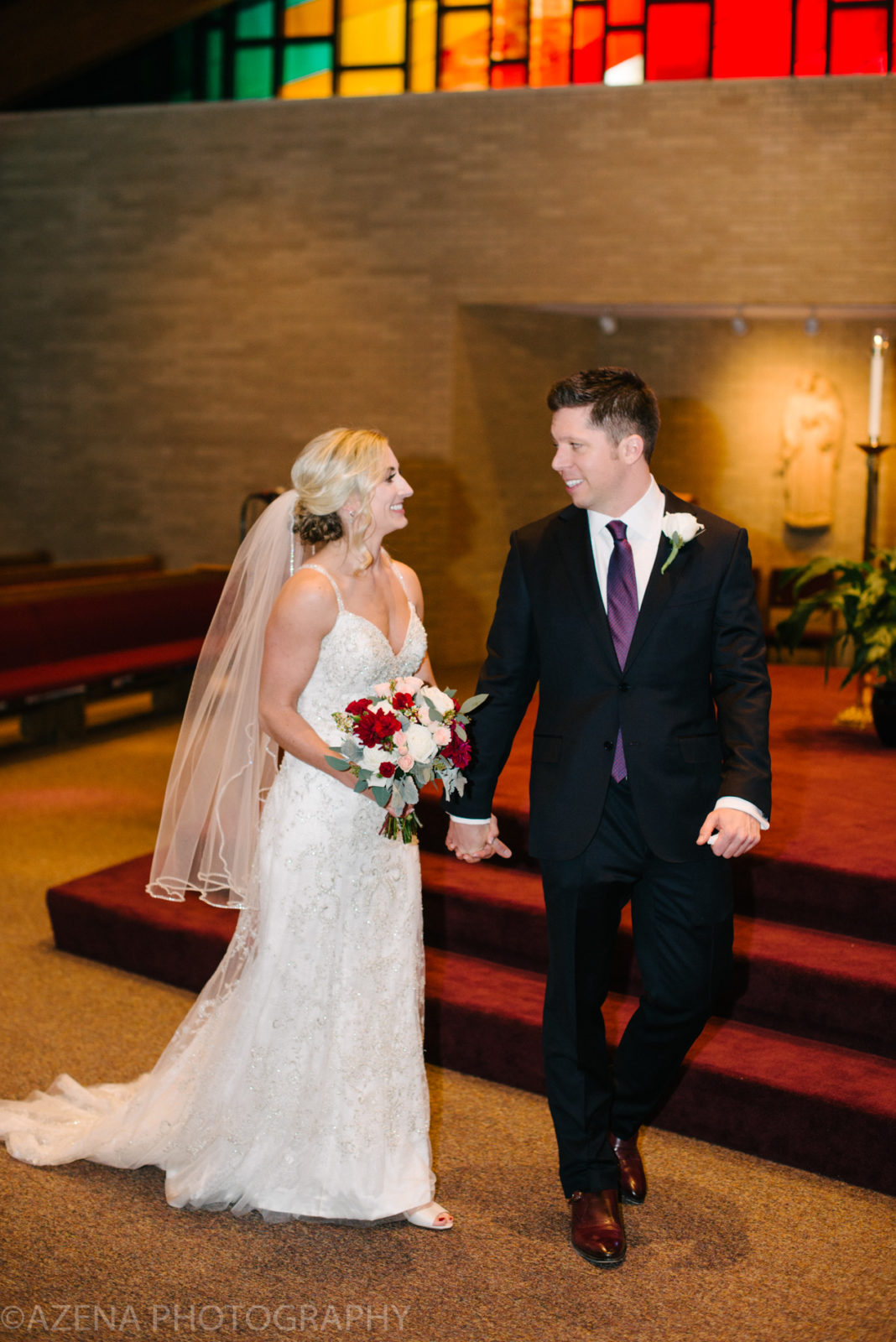 Bride and Groom walking together in church