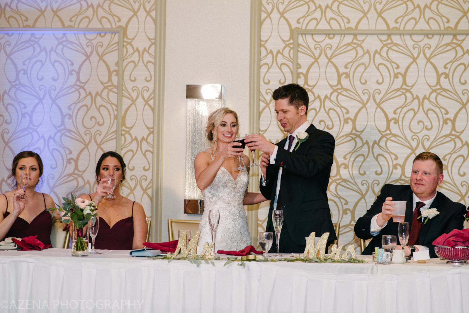Bride and Groom cheers at head table