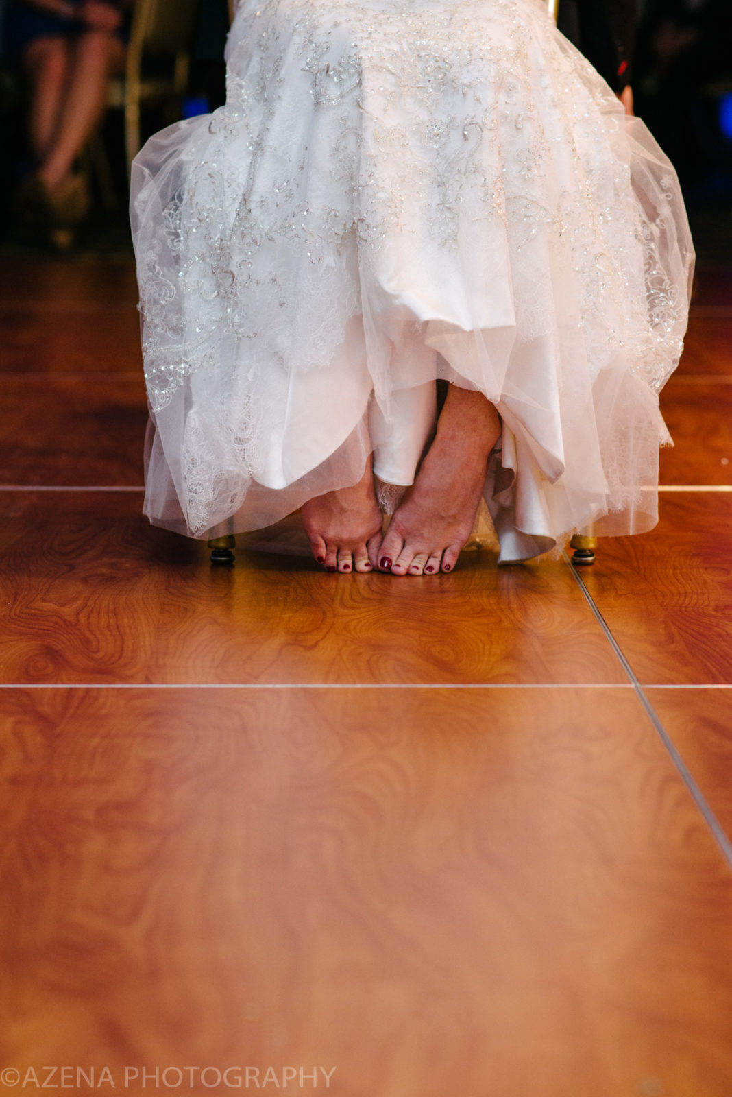 Bride's cute bare feet at wedding reception