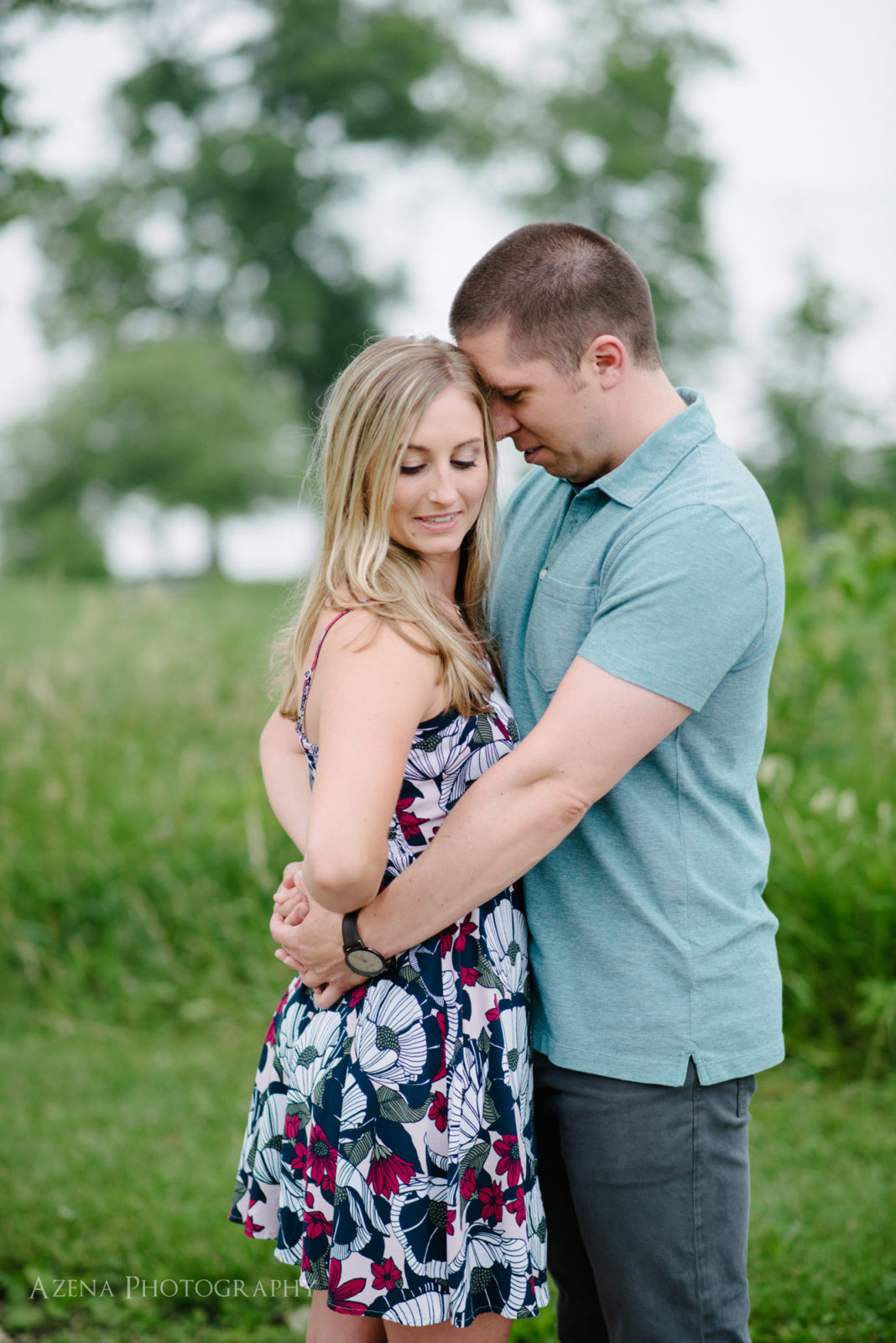 romantic moment during engagement session at Olin Park in Madison, WI