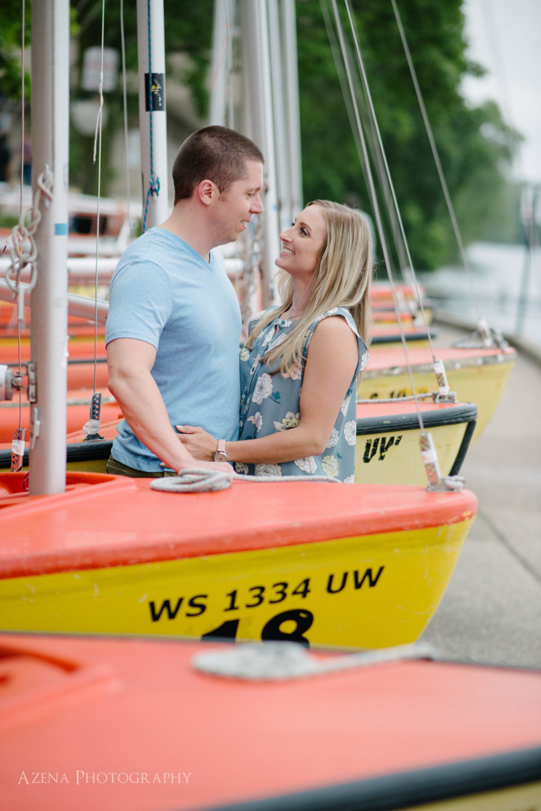 Engagement session on Lake Mendota at Memorial Union at UW Madison with the sail boats