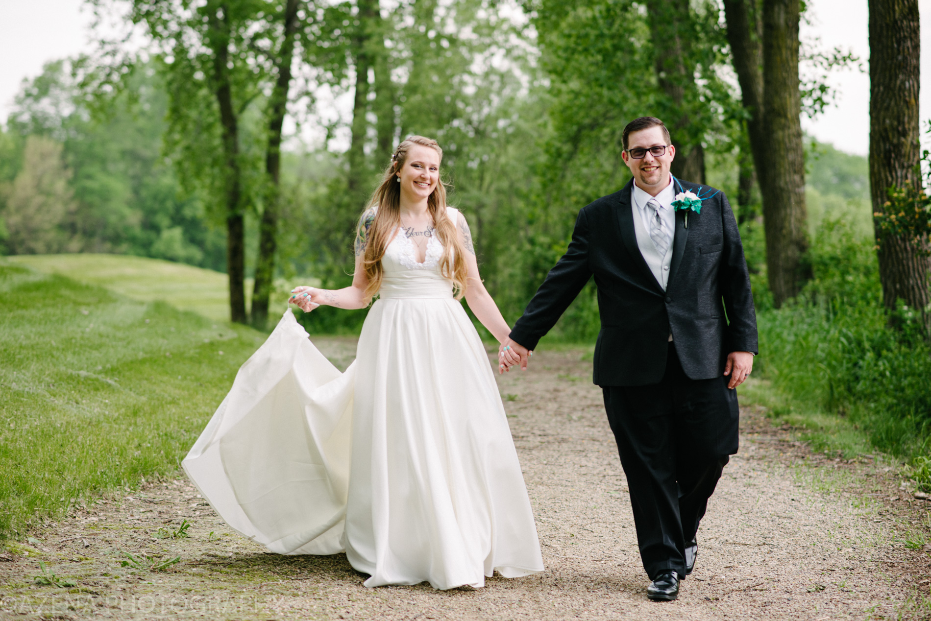 Happy bride and groom walking hand in hand