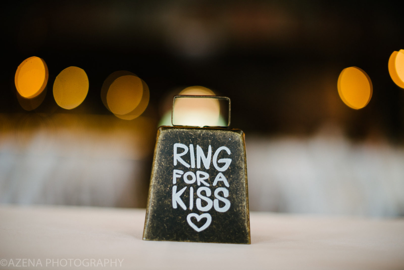 ring bell for a kiss at wedding