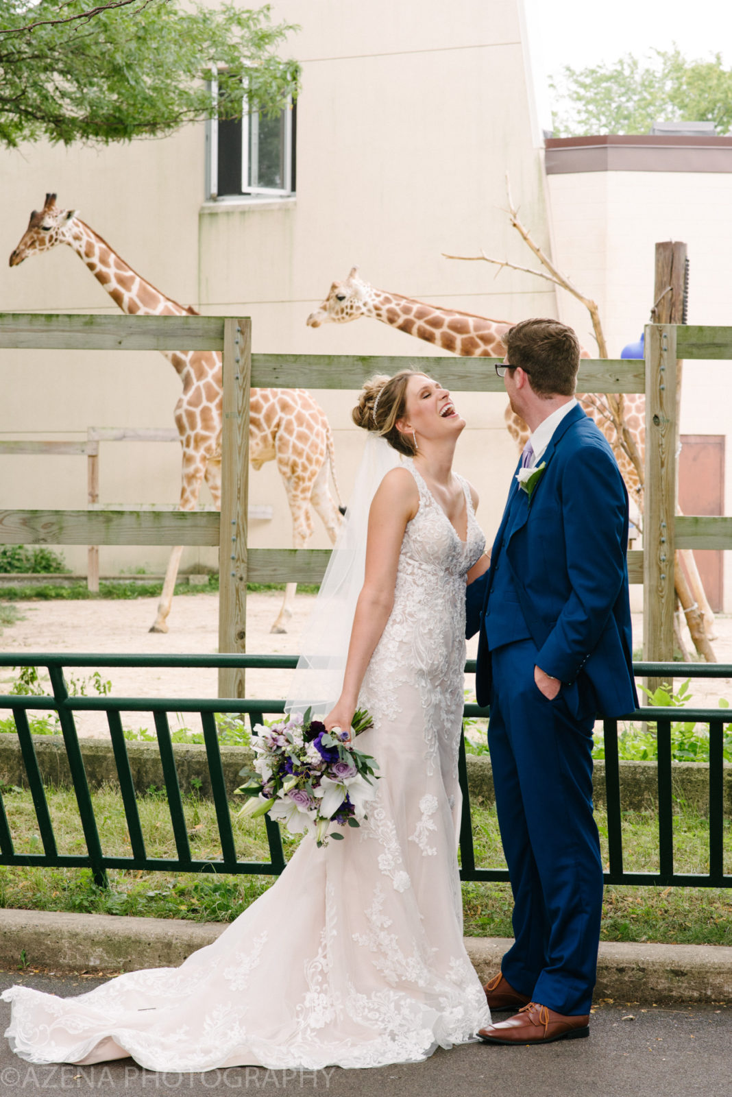 bride and groom at henry vilas zoo with giraffes